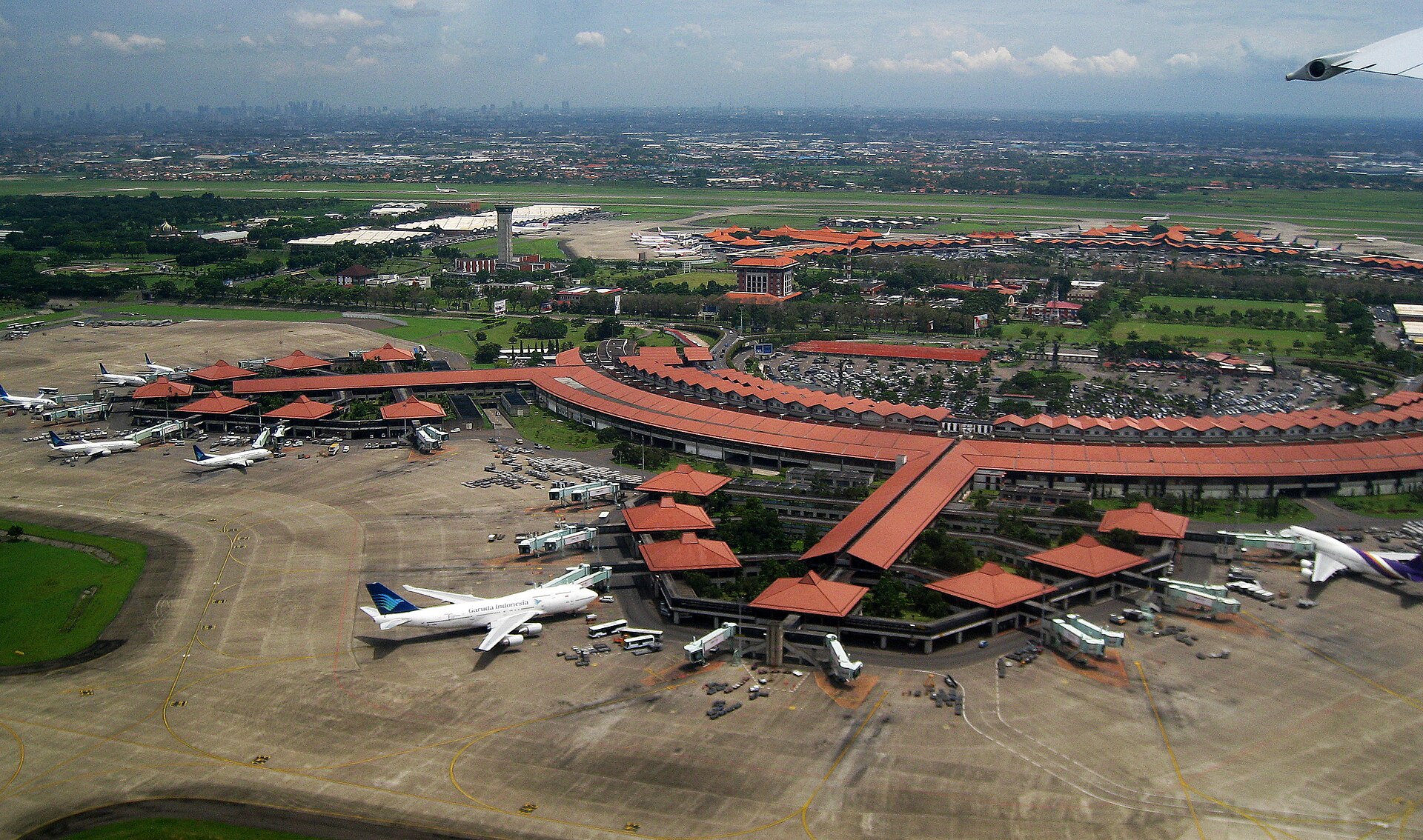 Aerial view of Soekarno-Hatta Airport terminal, apron, and runway